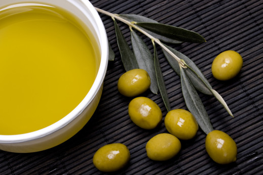 Extra virgin olive oil with green olives