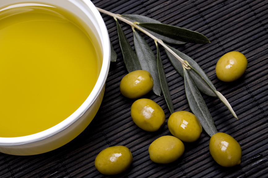 Extra virgin olive oil with green olives